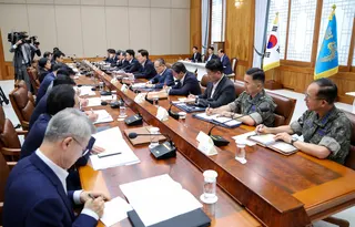 South Korean President Lee Jae Myung (fifth right) attends a meeting at the presidential office in Seoul on August 10 to discuss ways to promptly implement a large-scale investment initiative for semiconductor manufacturing facilities and AI data centres.  Photo: Yonhap/EPA