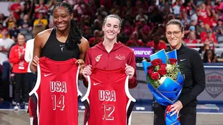 Aliyah Boston, Caitlin Clark and Stephanie White stand on the court during a Team USA honor ceremony.