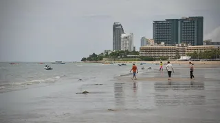 People walking on a beach in Pattaya