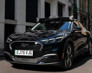 A Wayve self-driving taxi on a street
