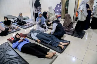 Students suffering from food poisoning receive treatment in Sidoarjo, East Java, Indonesia on Wednesday. Photo: EPA