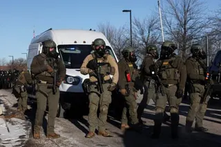 federal agents stand guard outside