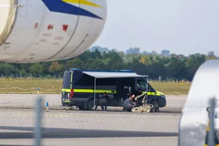 LEIPZIG, GERMANY - AUGUST 5: Police investigators work on the tarmac with a robot that is capable, amongst other things, of defusing explosives, near to Ukrainian Antonov cargo plane at Leipzig/Halle Airport on August 5, 2026 near Leipzig, Germany. Airport workers reportedly discovered a drone yesterday on the tarmac near an Antonov at the airport that was equipped with an explosives detonator and an unidentified substance. Additionally, a DHL cargo plane that took off from the airport late last