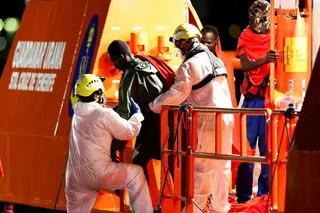 Rescuers help a migrant disembark from a Spanish coast guard vessel at the port of Arguineguin, on the island of Gran Canaria, Spain on September 3, 2026.