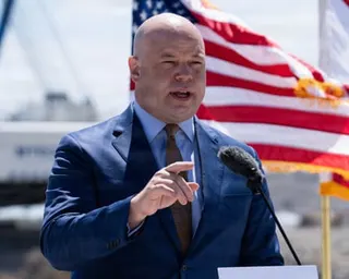 a man speaking on a podium