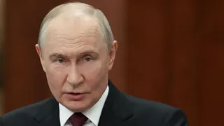 Vladimir Putin, head and shoulders, in a suit