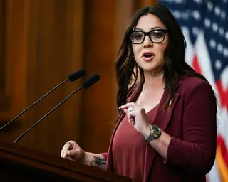 a woman speaks into a microphone