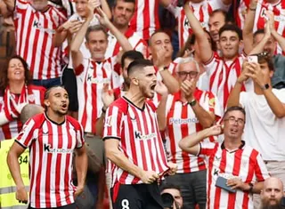 Oihan Sancet roars with delight after scoring Bilbao’s third goal as happy fans watch on