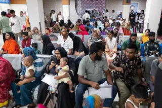 Parents wait with their children to receive treatment for measles in Dhaka on Thursday. Photo: AFP