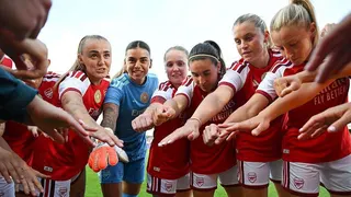 Arsenal players including Georgia Stanway and Alessia Russo put their hands towards the camera