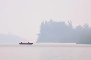 Hazy conditions at Kampung Telaga Air Jetty, Serian about 30km from Kuching city, today. PIC BY BERNAMA