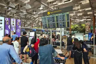 Affected commuters near Garuda Airlines check-in counter at Changi Airport Terminal 3  on Sept 6.