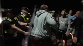 Anti-immigration protesters clash with police in UK after boat arrival