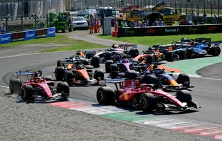 Ferrari’s British driver Lewis Hamilton (left) is pushed off the track by Ferrari’s Monegasque driver Charles Leclerc at the start of the Italian Formula One Grand Prix at the Autodromo Nazionale Monza circuit in Monza, northern Italy September 6, 2026. — AFP pic