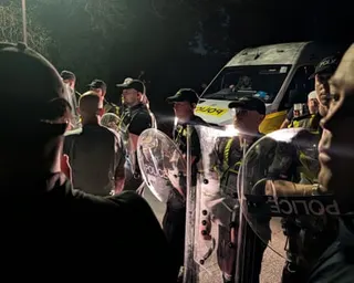 Police officers at the scene near Eastney Beach, Portsmouth, where hundreds of protesters gathered
