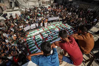 Mourners gather for a mass burial of around 100 Palestinians, including 62 children, whose remains where recovered from rubble, in Gaza City, on September 6, 2026. — AFP pic
